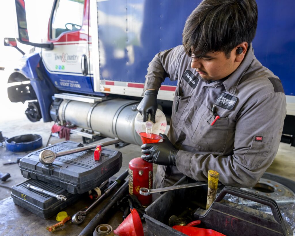 Truck Mechanic Working on Truck Parts
