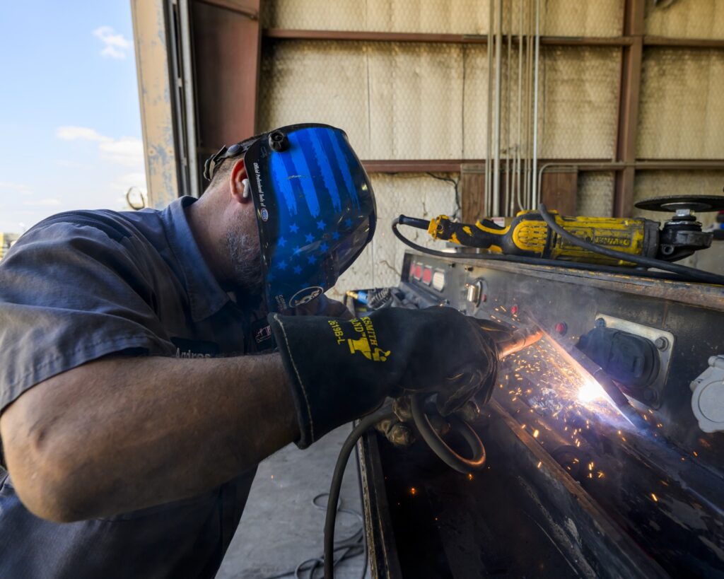 Truck Body Shop Mechanic working on truck