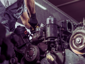 Mechanic fixing overheating diesel engine